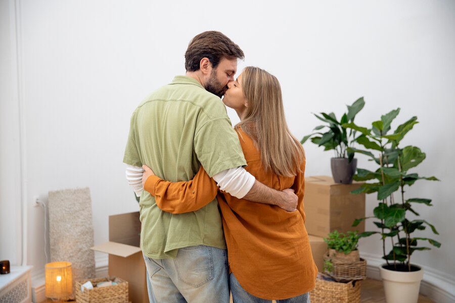 young-couple-moving-new-home_23-2149242100