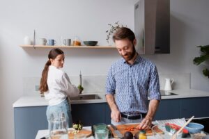 medium-shot-couple-cooking-together_23-2149048141